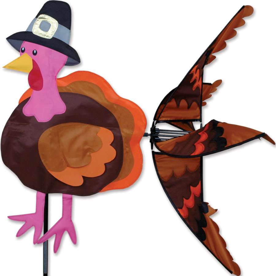Turkey Spinner with stainless steel construction rotating a turkey on a grill, showcasing even cooking outdoors for succulent meals.