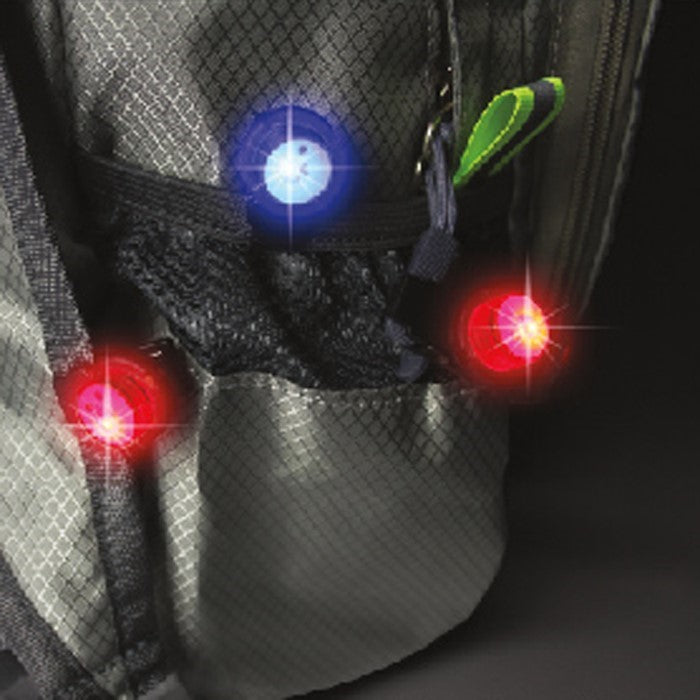 Five UFO Red/Blue LED Mini Lights with clip-on design, illuminating accessories for kites and outdoor gear in a night setting.