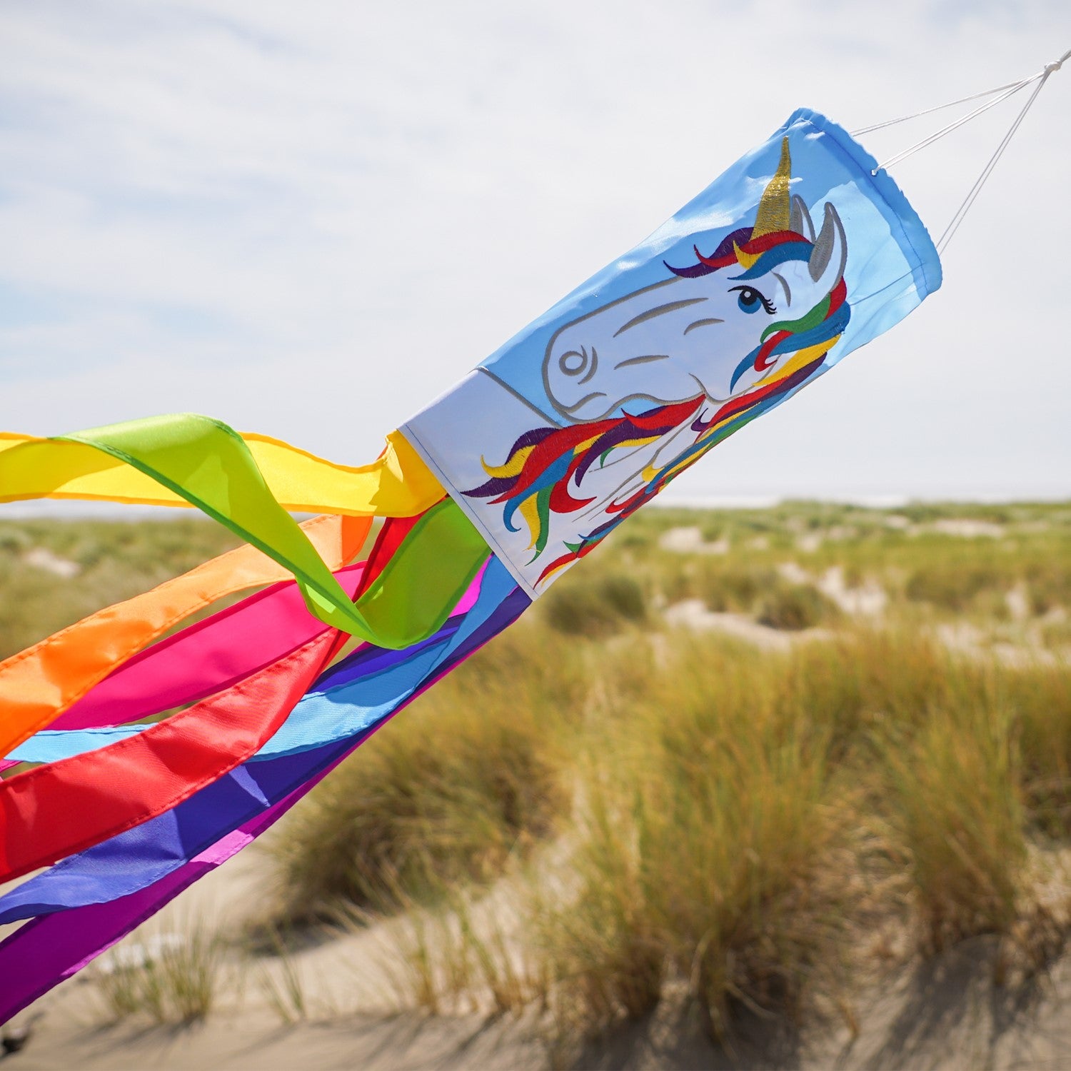 Unicorn 40-inch windsock in vibrant colors with a whimsical design features embroidered details, fluttering tails, and durable material for outdoor enjoyment.