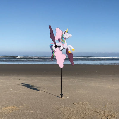 Unicorn Whirligig garden spinner featuring a whimsical unicorn design and vibrant colors, spinning in gentle outdoor breeze.