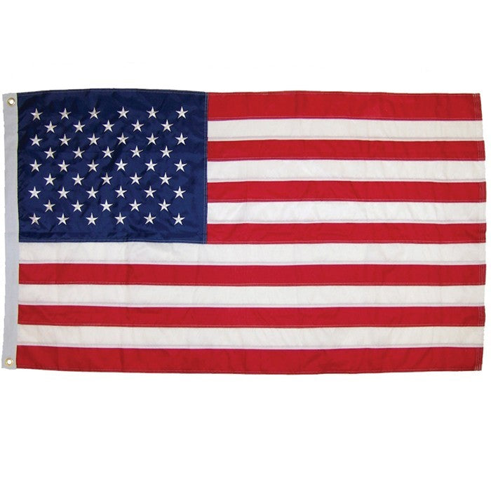 US Flag Embroidered 3x5 Grommet Flag featuring vivid red, white, and blue colors with embroidered stars displayed outdoors.