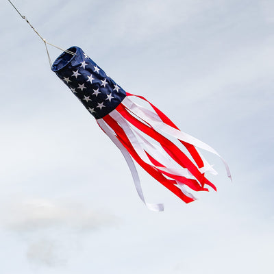 U.S. Stars and Stripes Embroidered 40-inch windsock with embroidered stars and colorful tails, fluttering outdoors in a patriotic display.