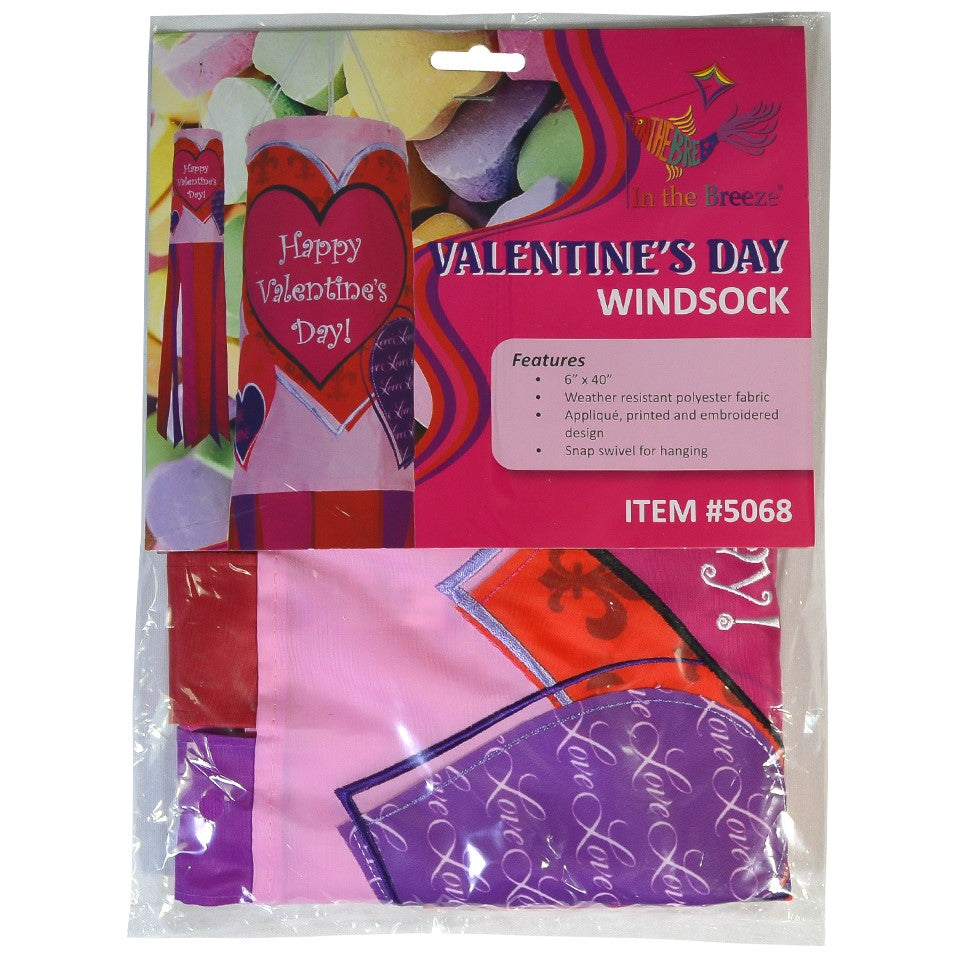 Valentine's Day 40-inch windsock with colorful heart appliques, fluttering gently in the wind, displayed outdoors on a sunny day.
