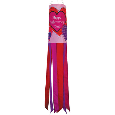 Valentine's Day 40-inch windsock with colorful heart appliques, fluttering gently in the wind, displayed outdoors on a sunny day.
