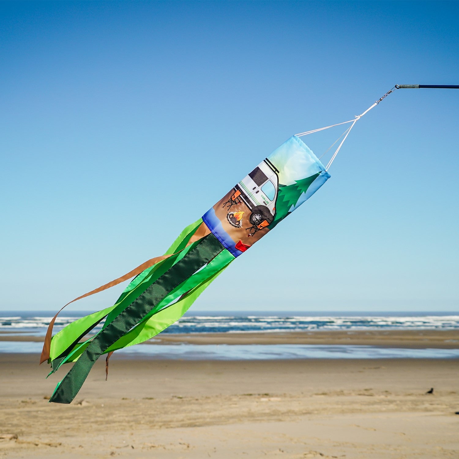 Vibrant 40-inch Van Life Inspiration Windsock with colorful graphics and fluttering tails displayed outdoors, capturing the spirit of camping and adventure.