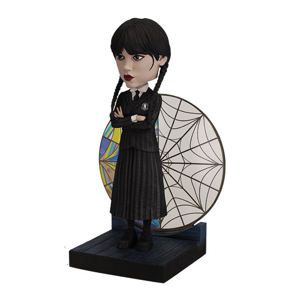 Wednesday Stained Glass Bobblehead featuring intricate colorful details, showcasing the iconic character with a decorative effect on display.