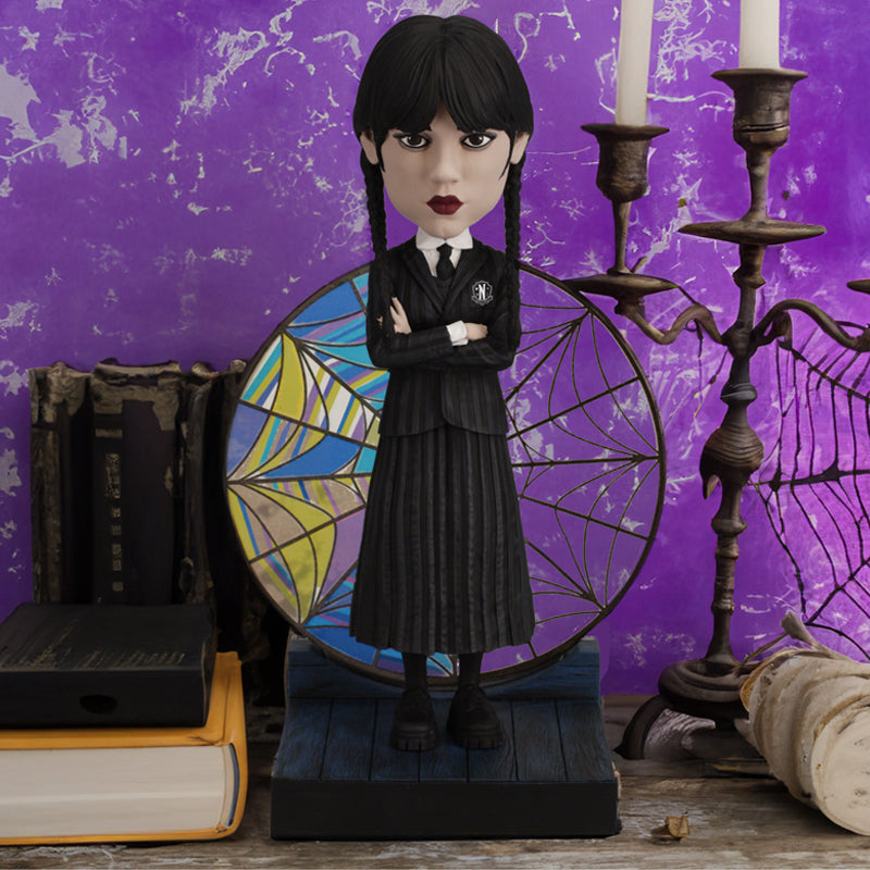 Wednesday Stained Glass Bobblehead featuring intricate colorful details, showcasing the iconic character with a decorative effect on display.