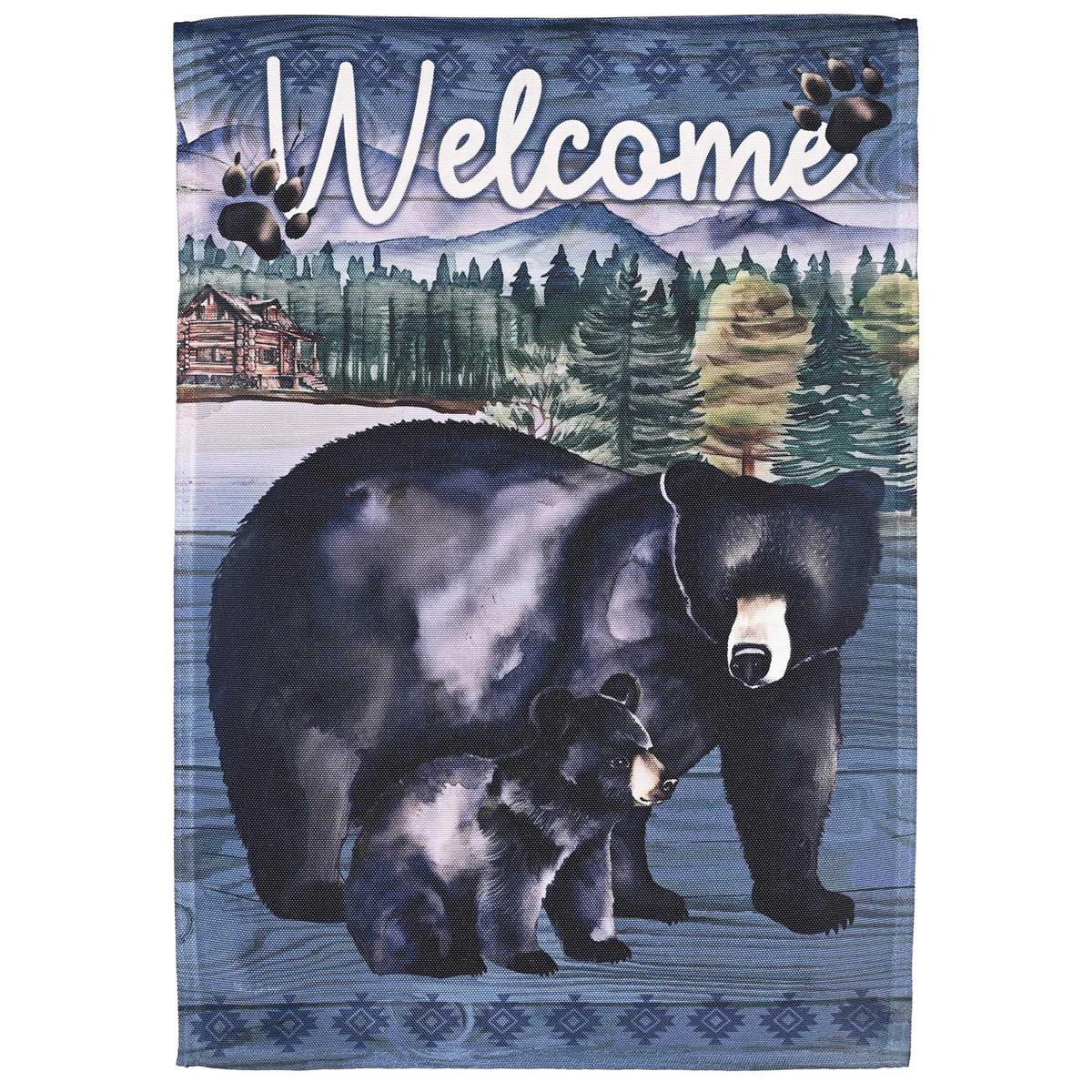 Welcome Black Bears garden flag featuring vibrant bear design on a heavy-duty fabric displayed outdoors in a garden setting.