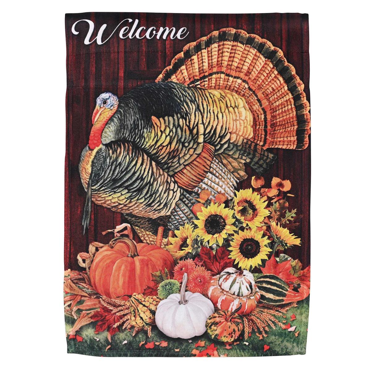 Welcome Turkey garden flag with a vibrant turkey design displayed outdoors, showcasing its colorful and inviting appearance in a garden setting.