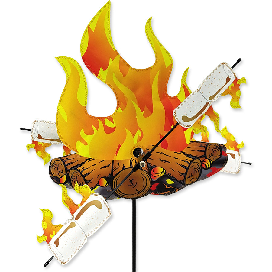 15-inch WhirliGig Spinner with colorful SunTex wings spinning in the breeze, mounted on an oversized ground stake in a beautiful garden setting.