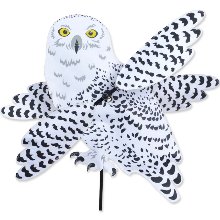 WhirliGig Spinner - Snowy Owl with vibrant SunTex fabric spinning in the breeze, adding a whimsical touch to a garden setting.