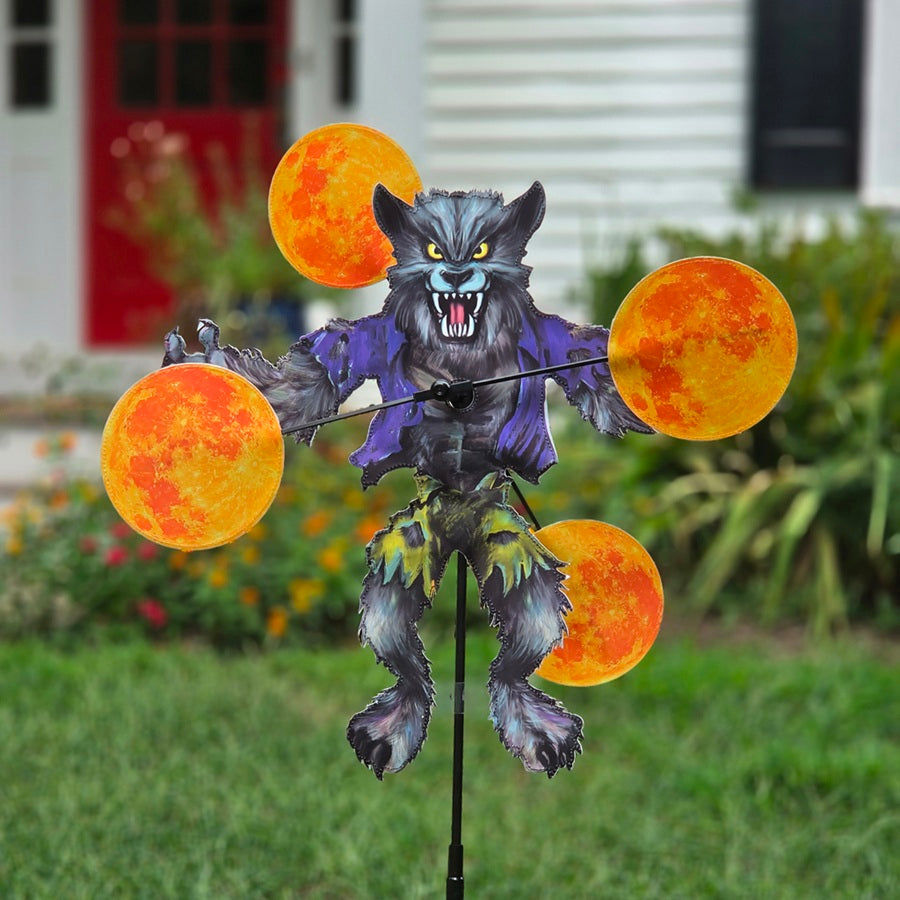 WhirliGig Spinner - Werewolf garden decoration with vibrant graphics in motion, displaying a whimsical werewolf theme outdoors.