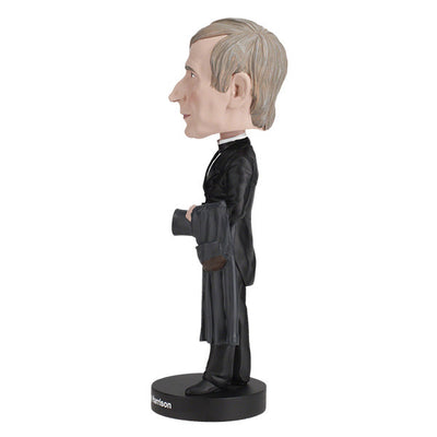 William Henry Harrison bobblehead showcasing detailed features and vintage attire, celebrating the ninth U.S. President in a vibrant display.