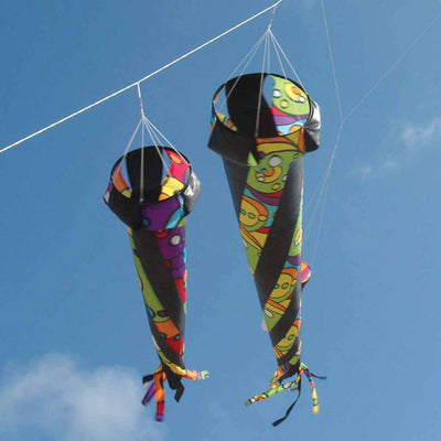 Wind Turbine 150 - Rainbow Orbit, a colorful 150 cm turbine spinning in the wind, attached to a kite line in a bright outdoor setting.