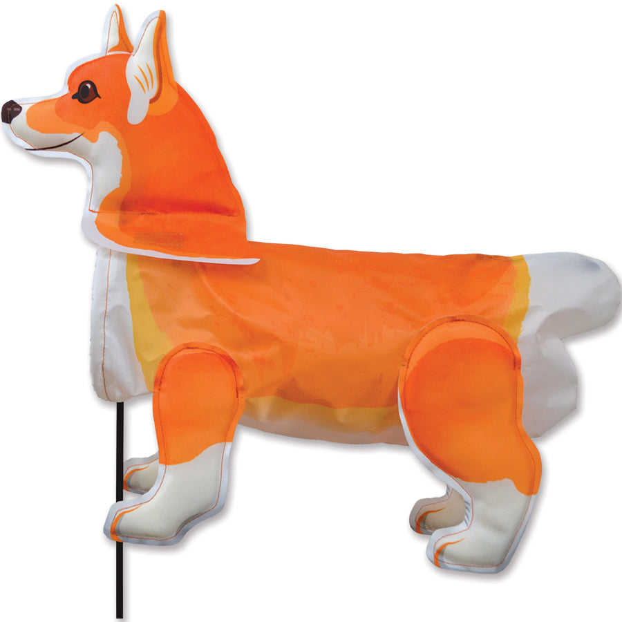 Windicator - Corgi 3D weather vane spinning in the wind, showcasing bright colors and friendly design in an outdoor garden setting.