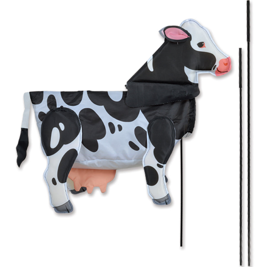 Windicator Recumbent Bike Flag featuring a playful cow design, displayed in motion on a recumbent bike, showcasing vibrant colors and 3-D shape.