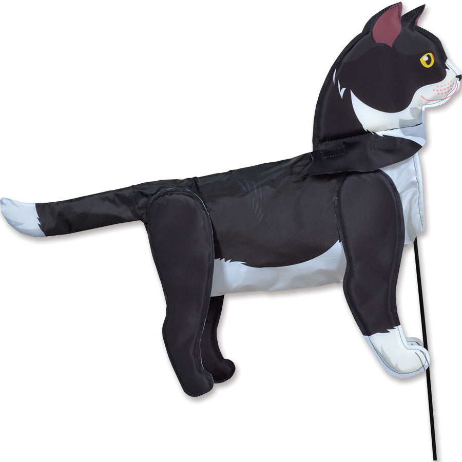 Windicator - Tuxedo Cat weather vane inflating in the wind, showcasing a lively 3-D tuxedo cat design on a sturdy pole set in a garden.