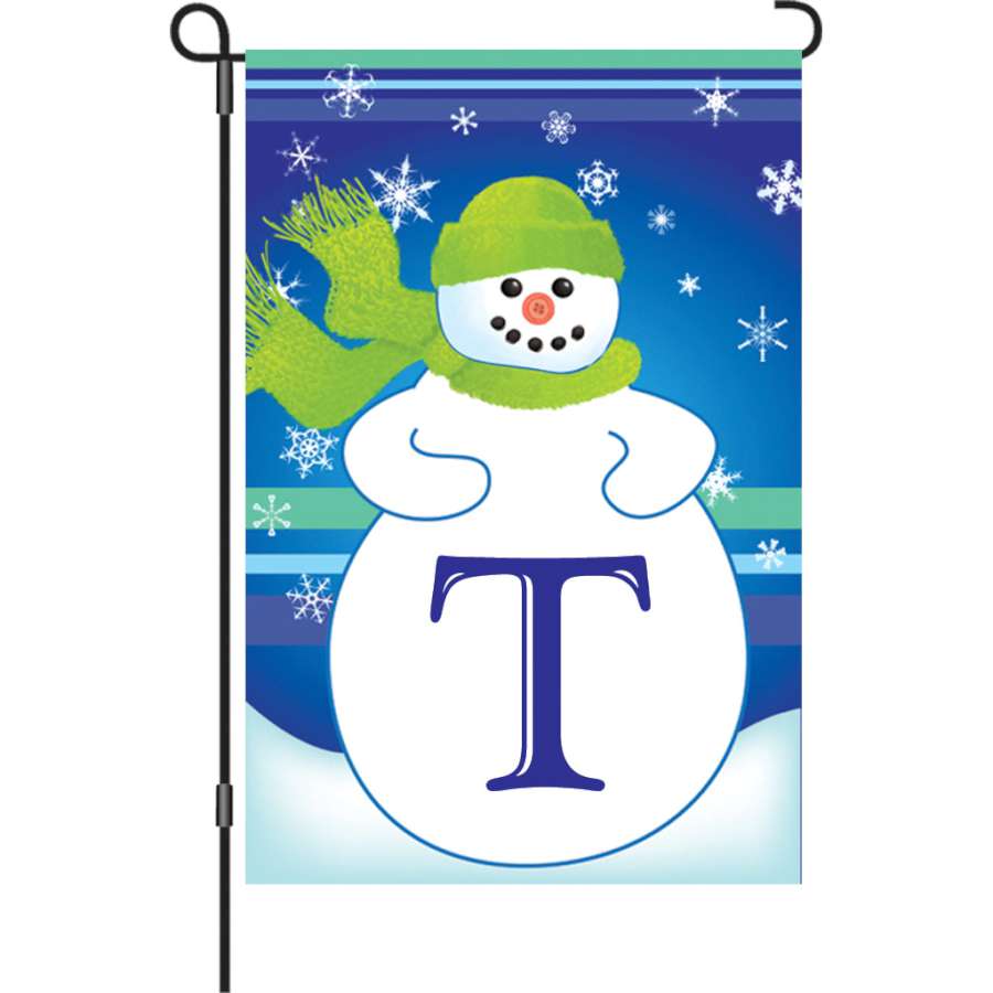 12 in. Winter Monogram Flag - T featuring vibrant colors and a personalized design displayed in a garden, perfect for seasonal decor.