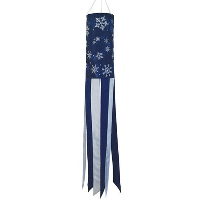 Winter Wonderland 40-inch windsock featuring a snowflake design in blue and white, gently fluttering outdoors in the winter breeze.