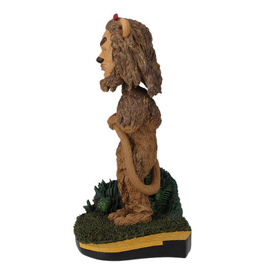 Wizard of Oz Cowardly Lion Bobblehead on a yellow brick road base, showcasing intricate details and vibrant colors, perfect for collectors.