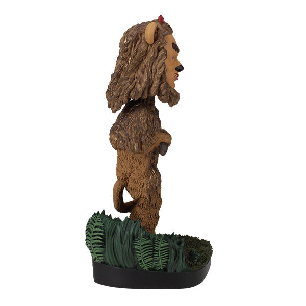 Wizard of Oz Cowardly Lion Bobblehead on a yellow brick road base, showcasing intricate details and vibrant colors, perfect for collectors.