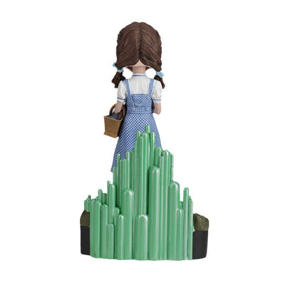 The Wizard Of Oz - Dorothy Gale Bobblehead showcases Dorothy in her classic outfit with RUBY SLIPPERSTM, capturing the essence of the beloved film character.