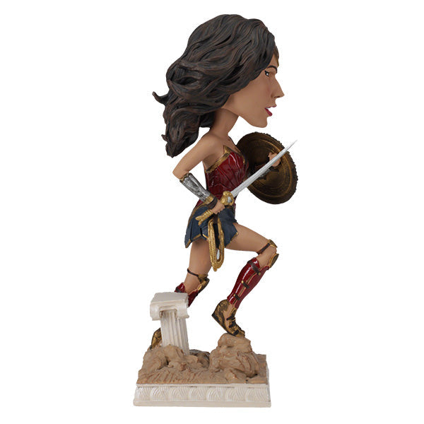 DC: Wonder Woman bobblehead featuring Gal Gadot's likeness, crafted from durable polyresin, showcased on a desk against a neutral backdrop.