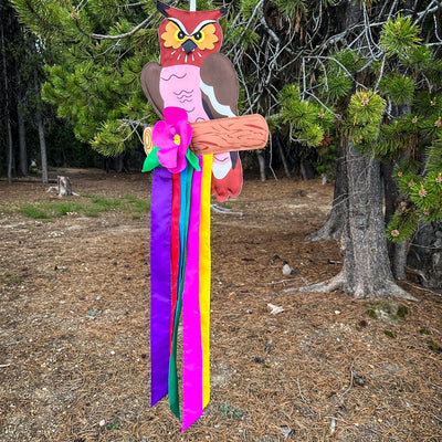 Woodland Owl Windtail featuring vibrant owl graphics and fluttering colorful tails hanging from a porch, designed for outdoor decor.