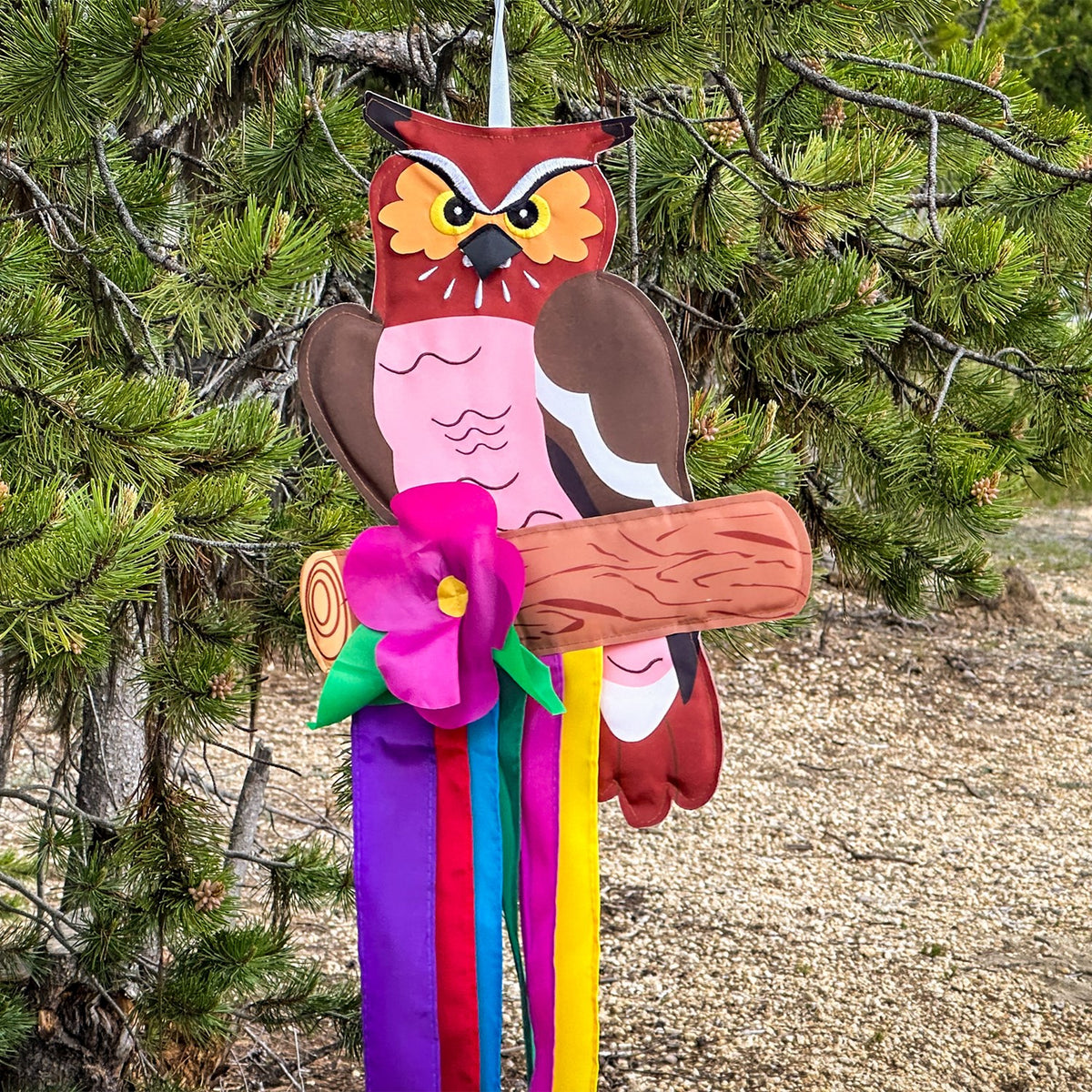 Woodland Owl Windtail featuring vibrant owl graphics and fluttering colorful tails hanging from a porch, designed for outdoor decor.