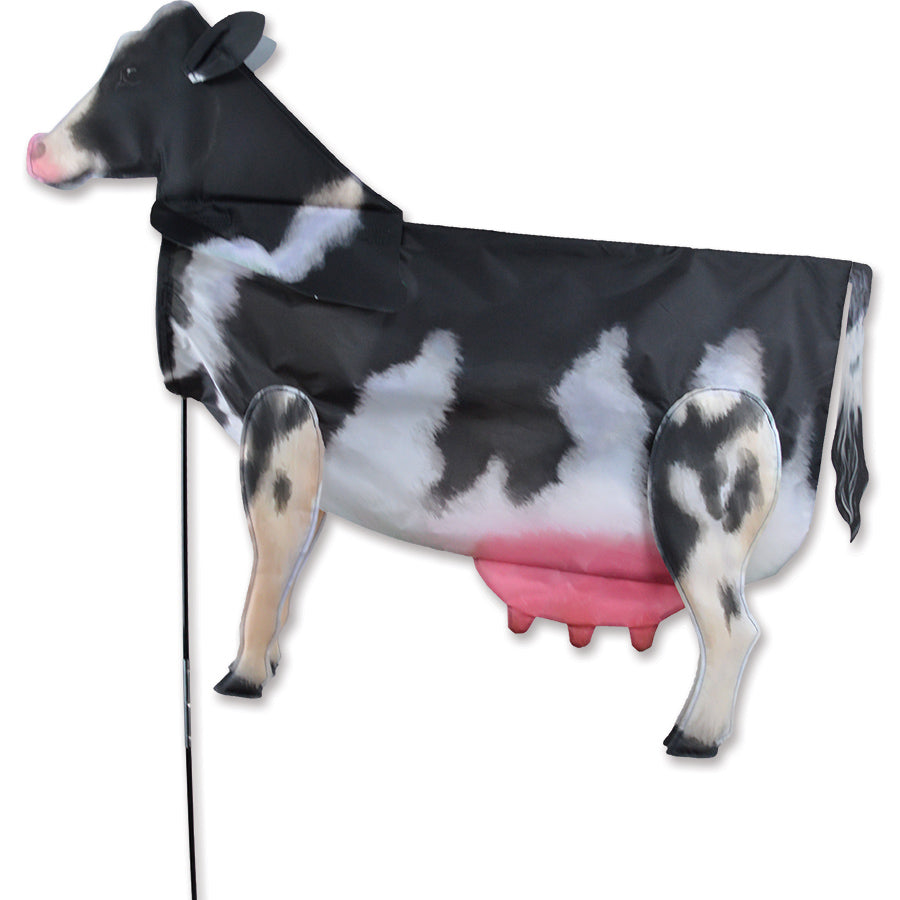 XL Windicator Weather Vane in Black Cow design inflated in a sunny yard, showcasing its fun and dynamic 3-D shape, ready to dance with the wind.