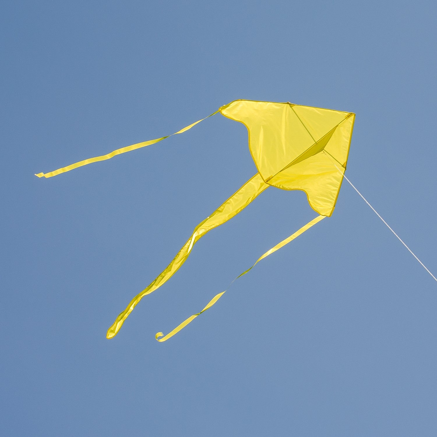 Yellow Colorfly 43" Fly-Hi Kite soaring in the sky with a bright blue background, ideal for novice kite flyers and outdoor fun.