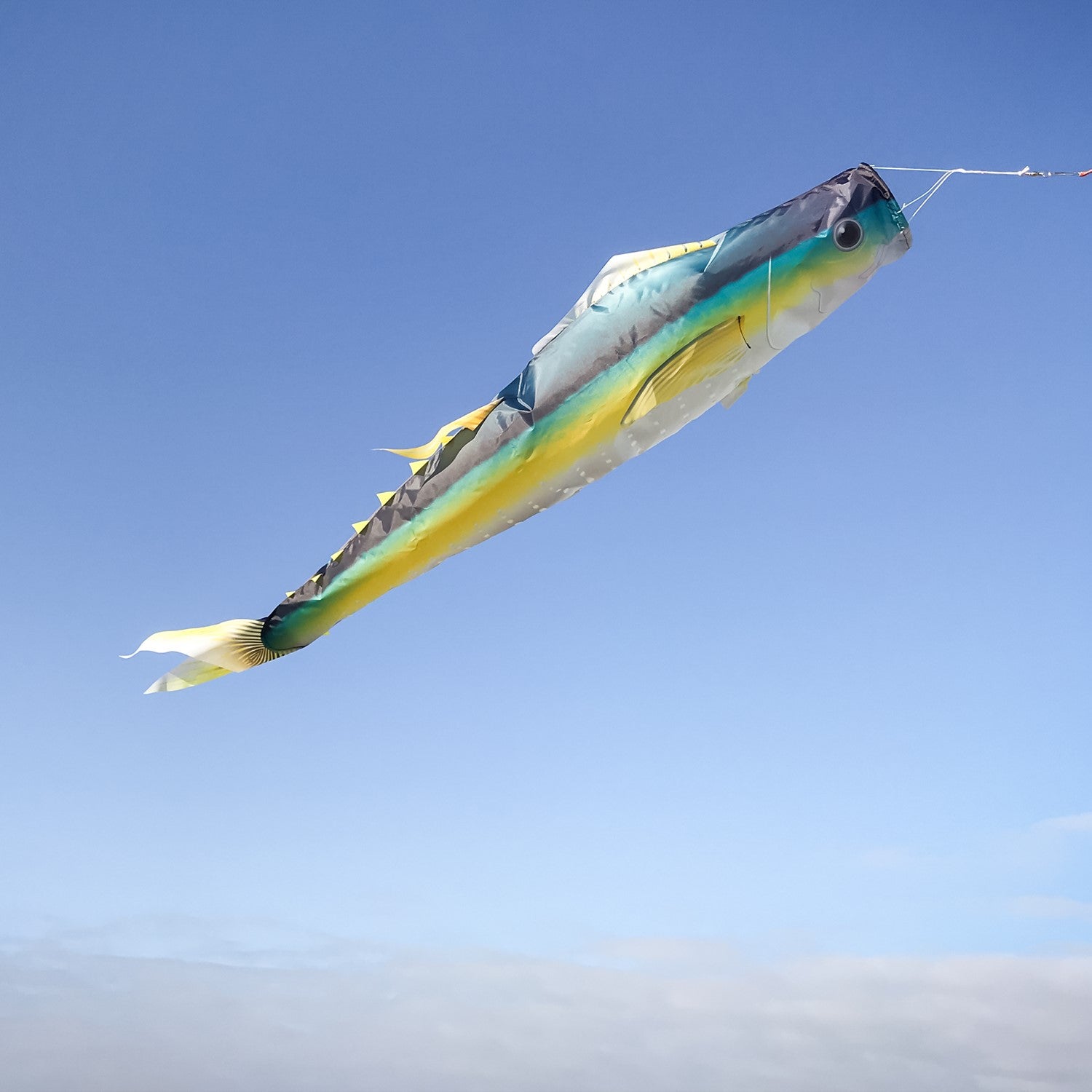 Yellowfin Tuna 48-inch fish windsock featuring realistic design, showcasing vibrant colors, displayed at a marina to celebrate ocean life.
