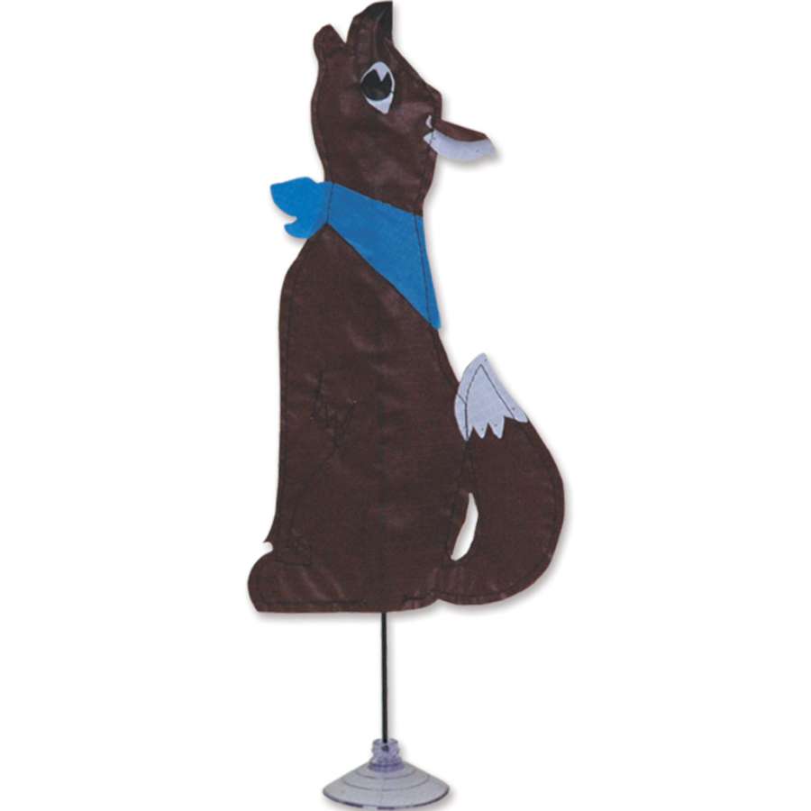 Zany Pal - Coyote, a colorful decorative figure, displayed on a desk with a plant in a cheerful indoor setting.