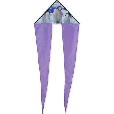 Zippy Flo-Tail Delta Kite featuring penguin design, soaring high in the sky, showcasing long colorful tails against a blue backdrop.