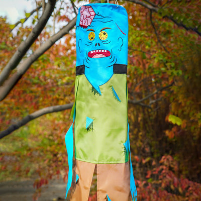 Colorful Zombie 40" Breeze Buddy Halloween decoration with free-flowing arms and legs, displayed outdoors swaying in the breeze.